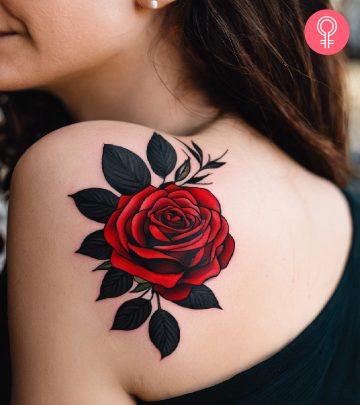 A woman with a black and red rose tattoo on her shoulder