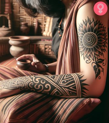 A woman with a floral tattoo with tribal designs