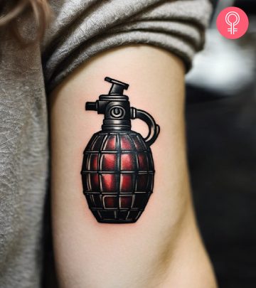 A woman with a grenade tattoo on her arm