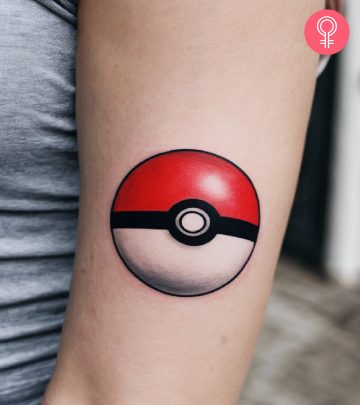 A woman with a pokeball tattoo on her arm