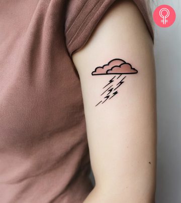 A woman with a thunderstorm tattoo on her upper arm