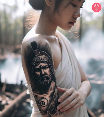 A woman with an Ares tattoo on her arm
