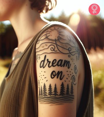 A woman with dream on tattoo on her arm