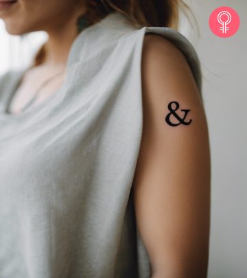 Ampersand tattoo on the arm of a woman