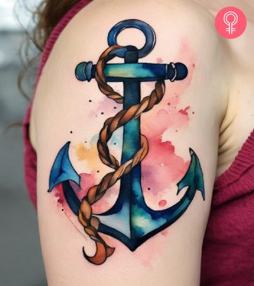 An anchor navy tattoo on a woman’s upper arm