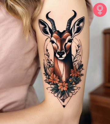 Antelope tattoo on the upper arm