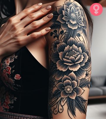 Asian tattoo of flowers on the upper arm of a woman