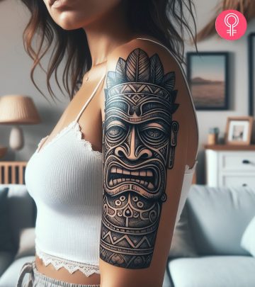 Tiki tattoo on the upper arm