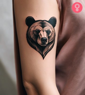 Bear tattoo on a woman’s upper arm