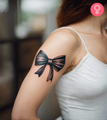 Bow tattoo on the arm of a woman