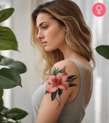 Alstroemeria tattoo on the upper arm of a woman