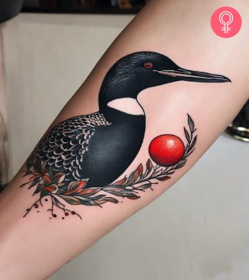 A loon tattoo on the forearm