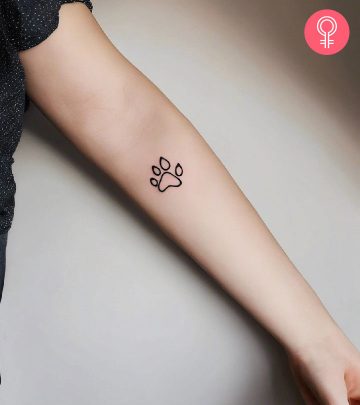 Cat paw tattoo on the upper arm