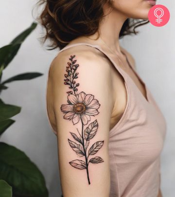 Freehand flower tattoo on the upper arm