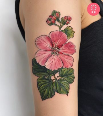 Geranium tattoo on the upper arm of a woman
