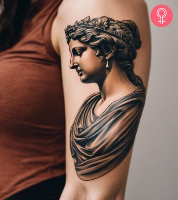 Greek statue tattoo on the arm of a woman