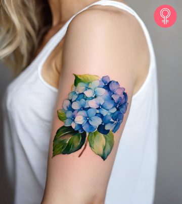 Hydrangea tattoo on the upper arm of a woman