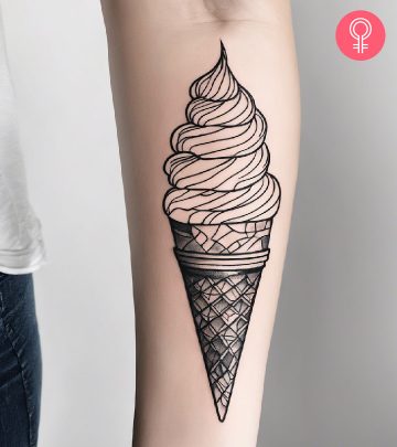 Ice cream inked in line art style on the forearm