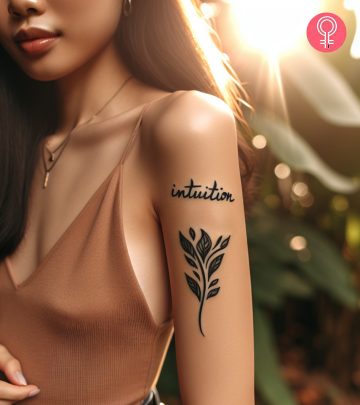 Intuition tattoo on a woman’s upper arm