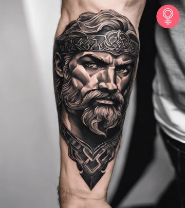 Man with a Hercules tattoo on the arm