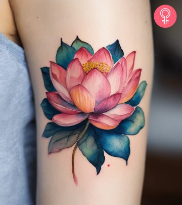 New beginning lotus tattoo on the upper arm of a woman