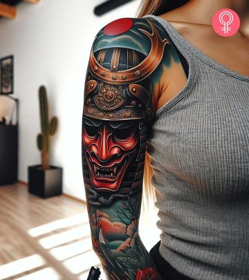 Samurai mask tattoo on the arm of a woman