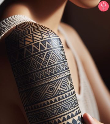 Taino tribal tattoo patterns on the arm of a woman