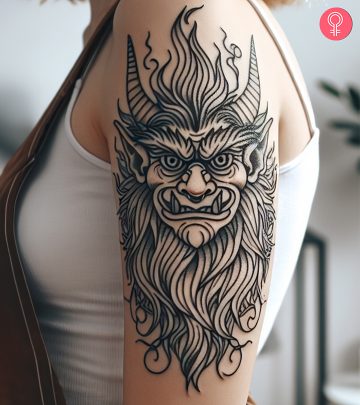 A goblin tattoo on the arm
