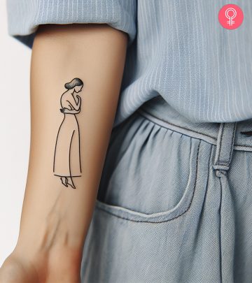 Woman flaunting a self-love tattoo on her forearm