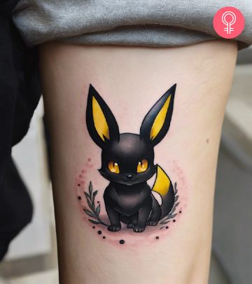 Woman with Umbreon tattoo on her arm