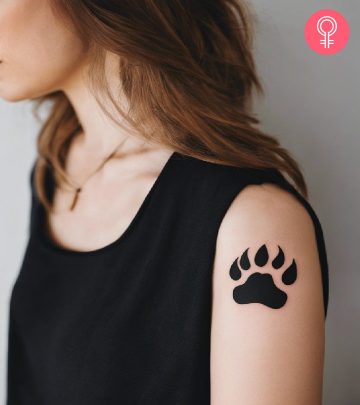 Woman with a bear paw tattoo on her arm
