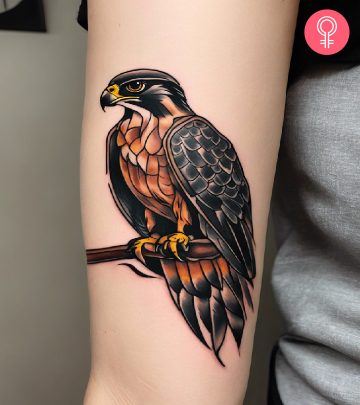 Woman with a falcon tattoo on her arm