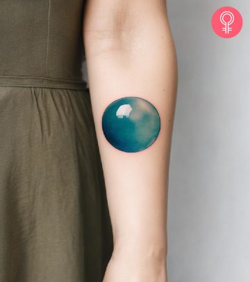 Woman with bubble tattoo on her arm