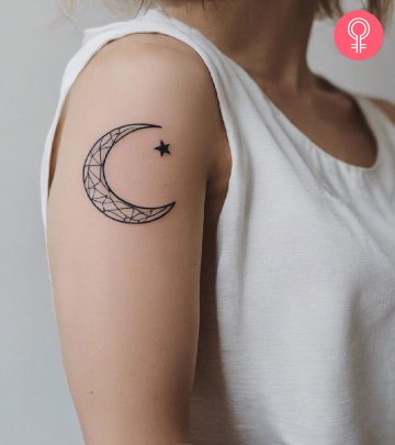 Woman with celestial tattoo on her upper arm