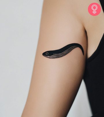 Woman with eel tattoo on her arm