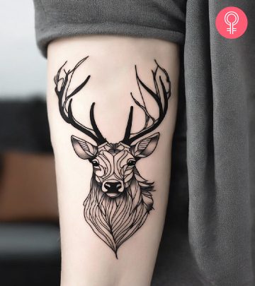 Woman with elk tattoo on her arm