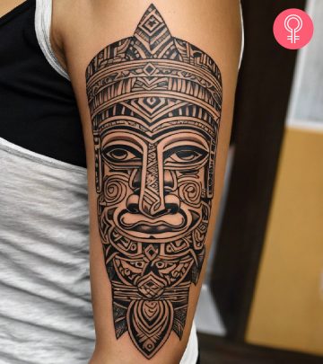 Woman with marquesan tattoo on her arm