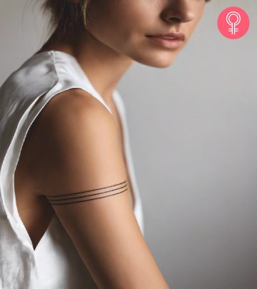 Woman with straight line tattoo on the upper arm