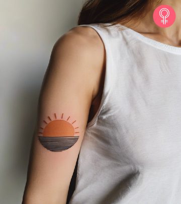 woman with half sun tattoo on upper arm