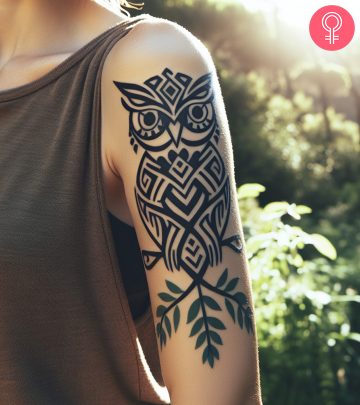 A woman with a tribal owl tattoo