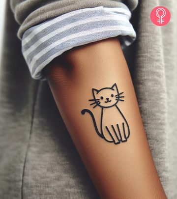 A doodle cat tattoo on the wrist