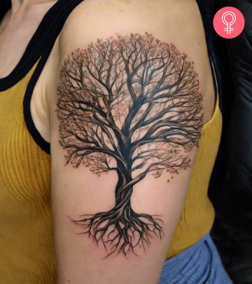 A tree and root tattoo on a woman’s arm