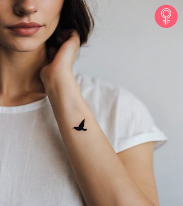 A woman flaunting a blackbird tattoo on her wrist