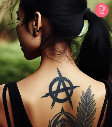 A woman with an anarchy tattoo on her back
