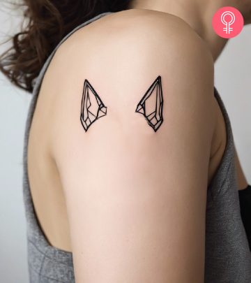 Dog ear tattoo on the arm