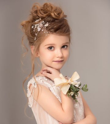 A kid with a flower girl hairstyle