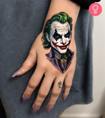 A colorful Joker tattoo on the back of the hand